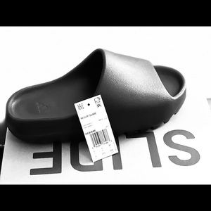 Yeezy slides. Brand new size 8 black onyx